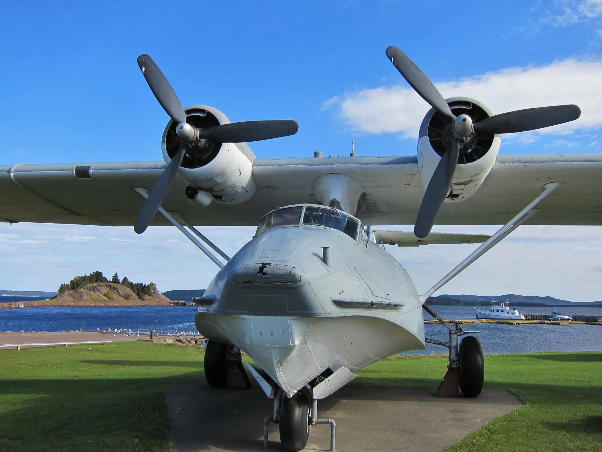Preserved Catalina flying boat on the Botwood waterfront, bay and Killick Island behind.