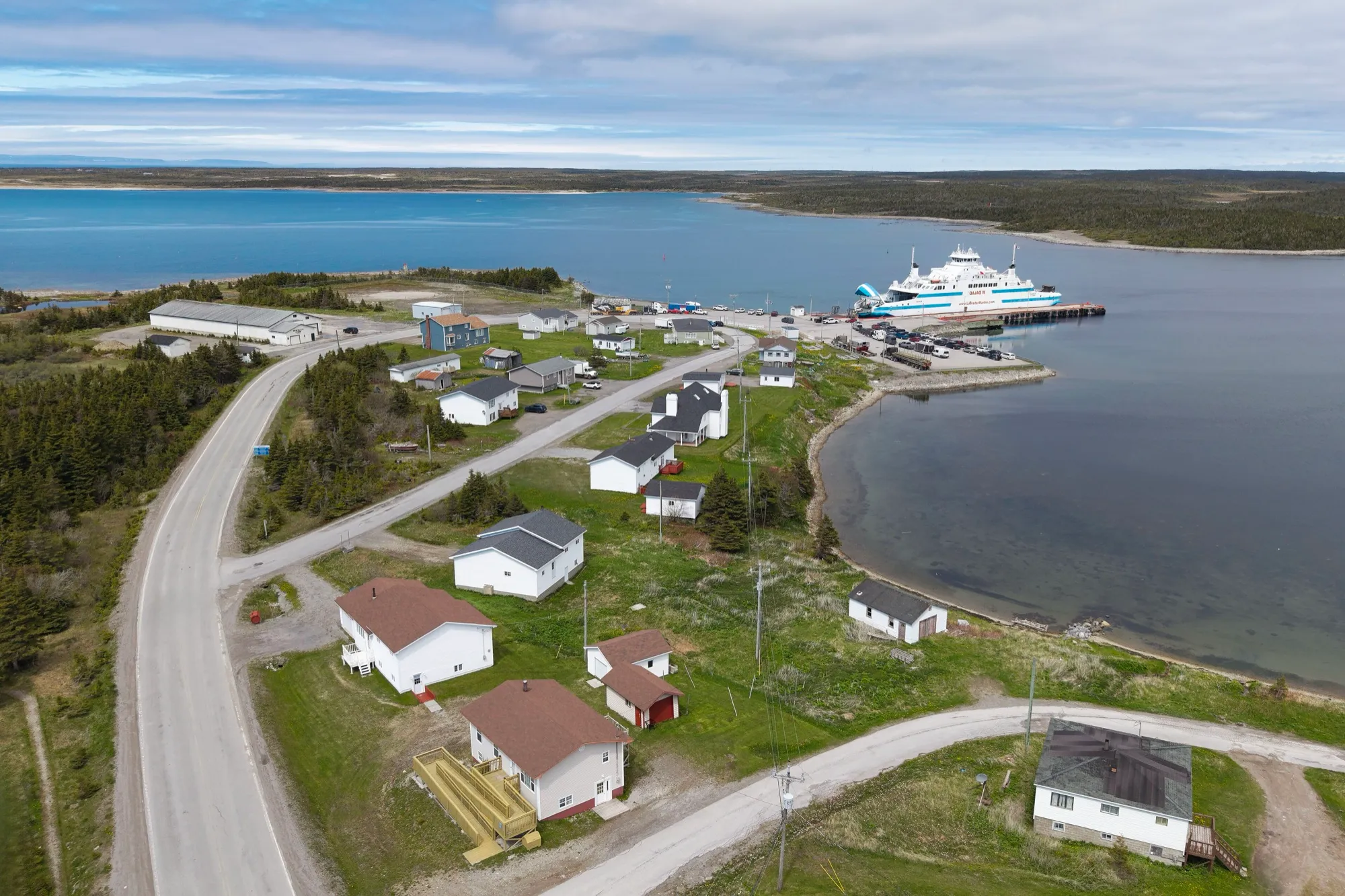 Aerial of St. Barbe with the Labrador ferry loading at the terminal wharf.